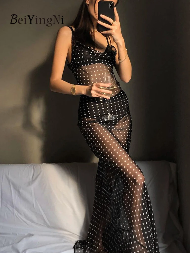 เดรสยาวตาข่ายลายจุดสไตล์โบฮีเมียนสำหรับผู้หญิง แบรนด์ Beiyingni เหมาะสำหรับใส่ไปเที่ยวชายหาด สายเดี่ยวผูกเชือก สีดำ ดีไซน์เซ็กซี่ สไตล์ลำลอง