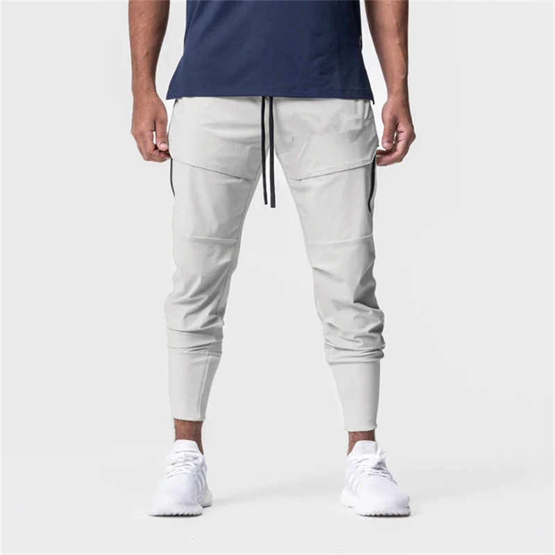 Calça masculina multi-funcional de secagem rápida, calça fina de caminhada elástica, moda casual