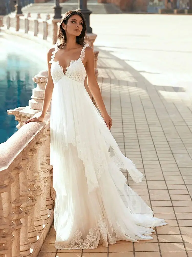 カスタマイズされた魅力的なエンパイアのウェディングドレスレース 2025 ブライダルドレスノースリーブの花嫁ドレスストラップ付きウェディングドレスバックアウト