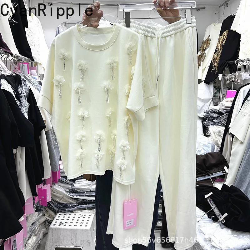 

Новый весенне-летний женский комплект из двух предметов: футболка с коротким рукавом, украшенная бисером и цветами, с бахромой + брюки с широкими штанинами на эластичной талии