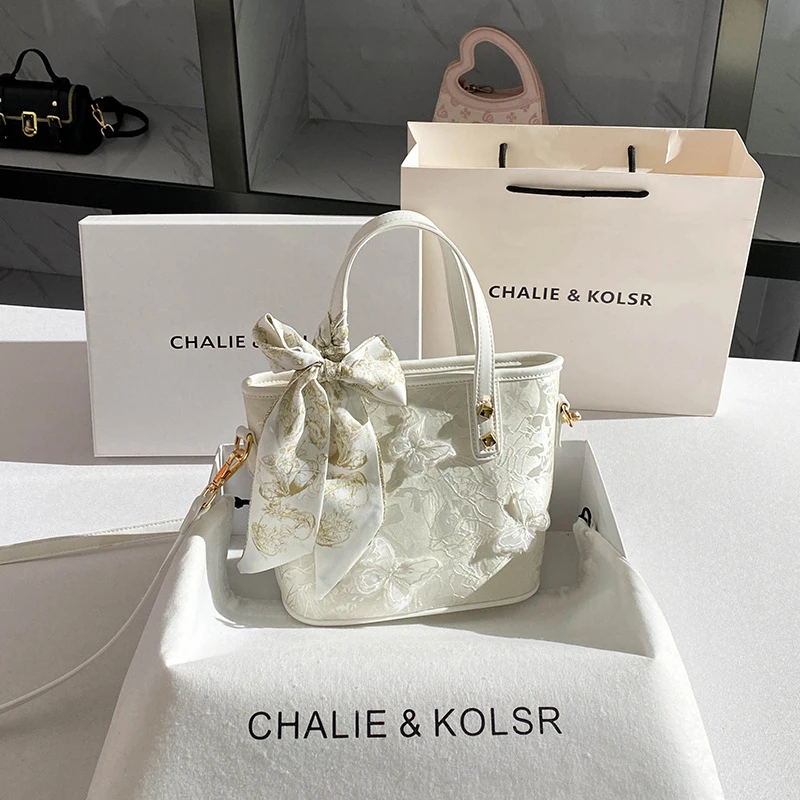 

Fashionable and trendy bowknot bucket bag, niche embroidered handbag