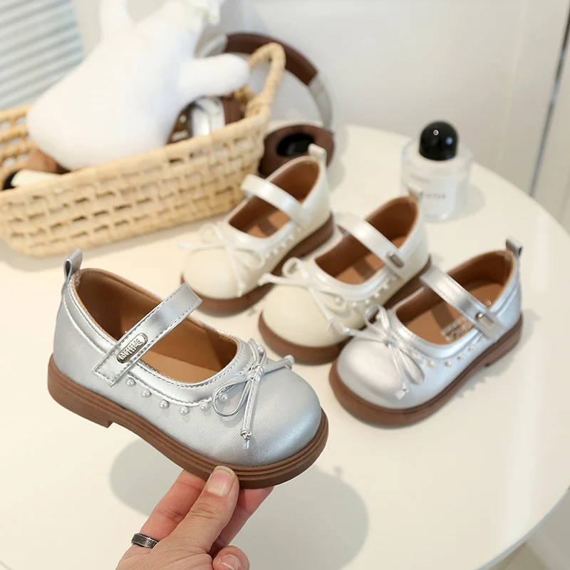 

Модные детские туфли для девочек с милыми бантиками, новинка 2026 года, детские туфли-принцессы с круглым носком, кожаные, нескользящие, на мягкой подошве, балетки