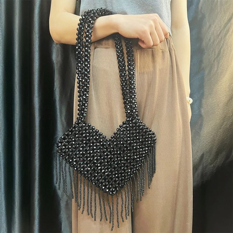 

Korean niche new summer heart-shaped hollow tassel heavy industry bag handmade bead bag party banquet shoulder bag
