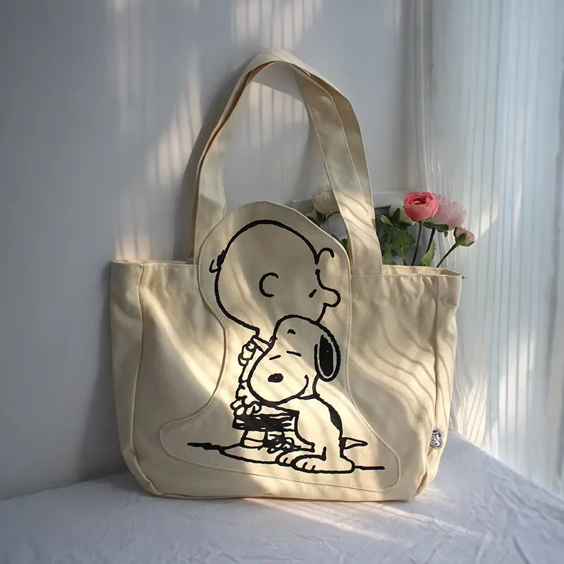 กระเป๋าผ้าใบผู้หญิงความจุสูงกระเป๋าแฟชั่นการ์ตูน Snoopy กระเป๋าถืออเนกประสงค์หนึ่งไหล่ Tote กระเป๋าเดินทางกระเป๋า