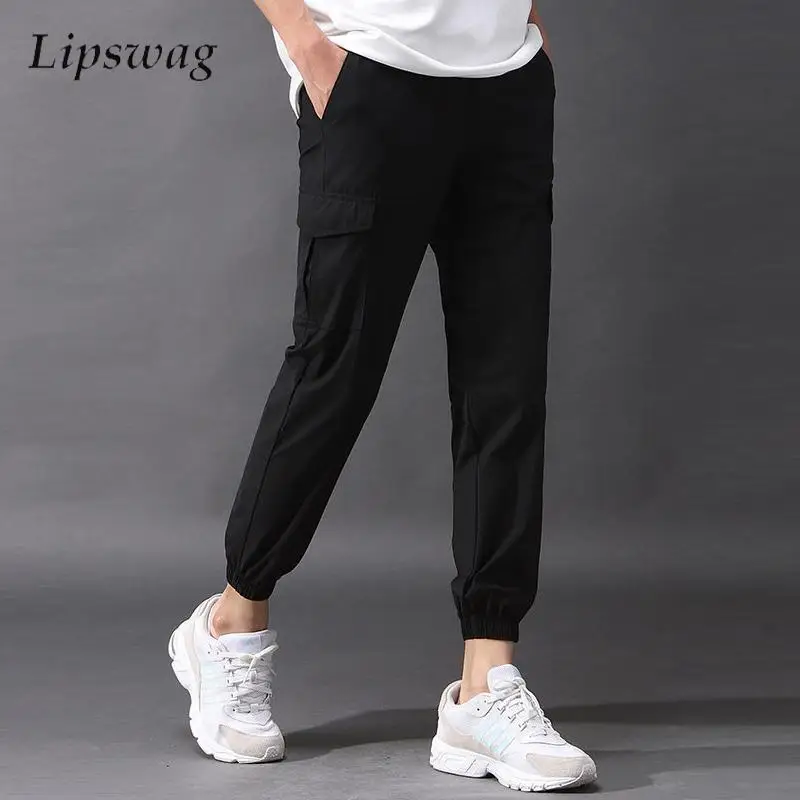 

Daily Casual Solid Color Slim Cargo Pants Men Autumn Leisure Patchwork Pockets Drawstring Pants Fashionable Mens Sports Trousers