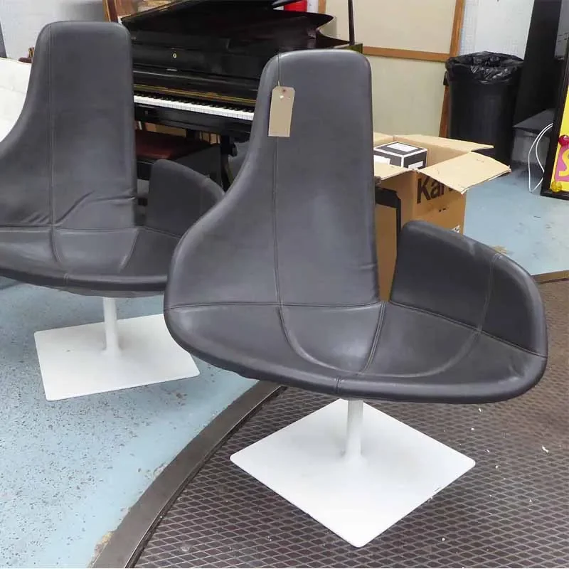 

Sculptural Accent Chair: A Personalized Single Seater with Premium Leather Backrest and Unique Form for a Modern Living Space.