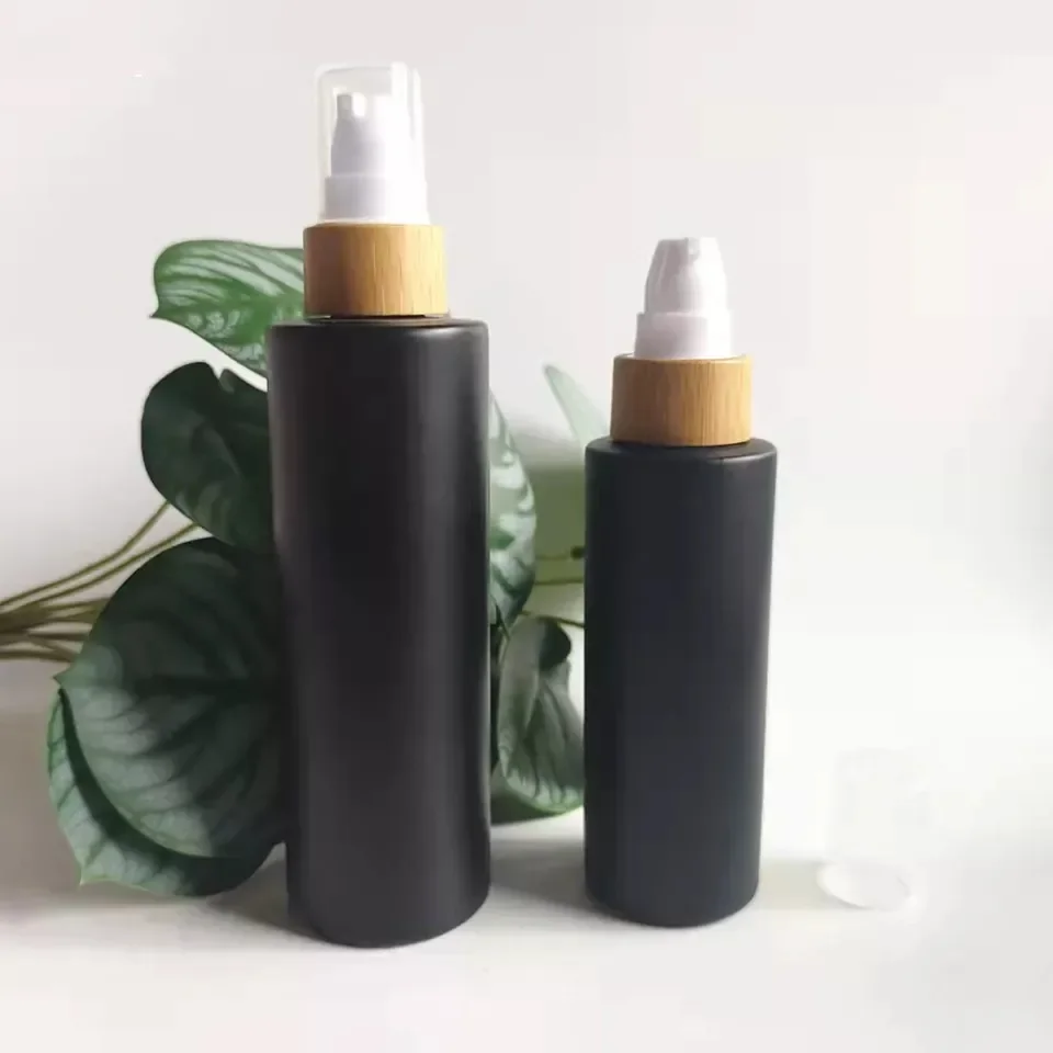 Cylinder Empty Black Frosted Glass Lotion Bottle Manufacturer Black Cosmetic Bottle Opaque Cosmetic Bamboo Pump Bottle forLotion