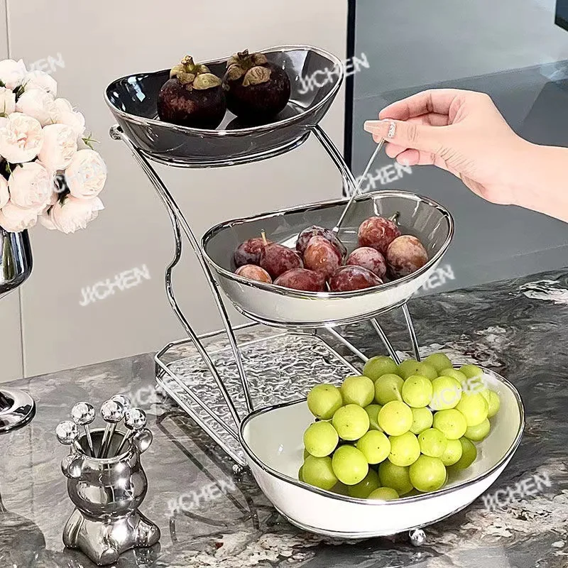 Juego de platos de fruta multicapa de cerámica ligera de lujo, plato de fruta seca de alta gama, plato de caramelo, refresco para sala de estar a la moda