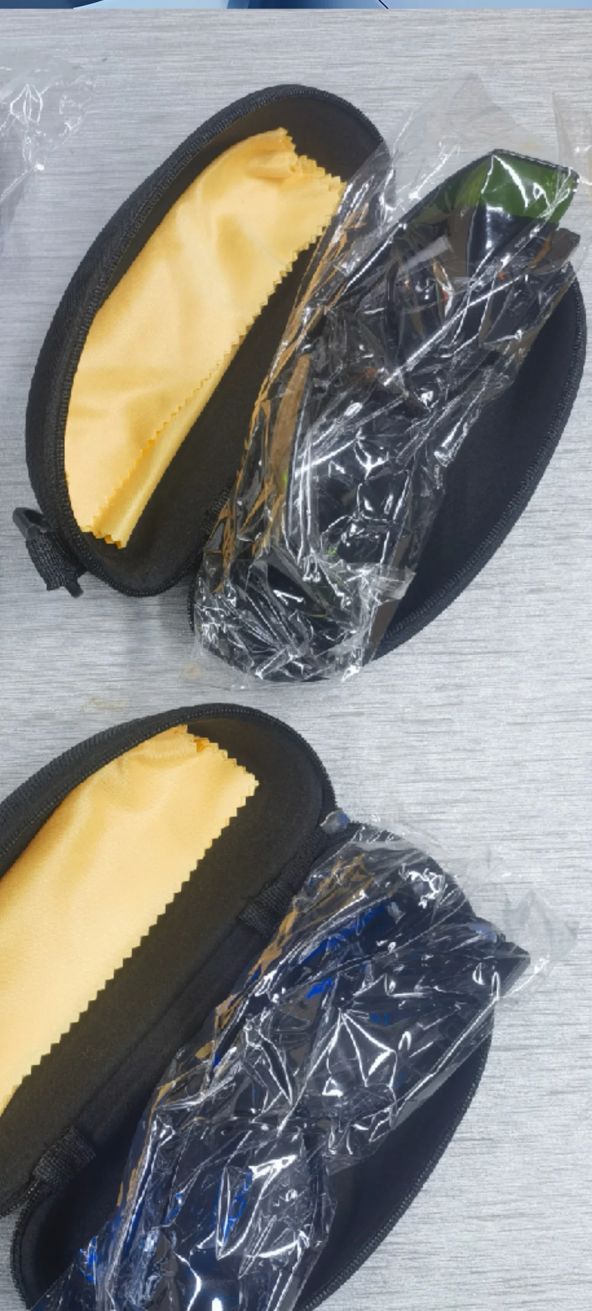 One blue and one green glasses two glasses boxes