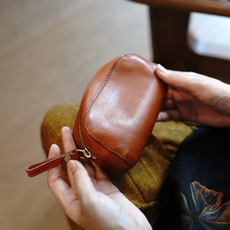 Fashion clutch bag, retro portable coin bag, headphones, cultural play, walnut bracelet, leather texture storage bag