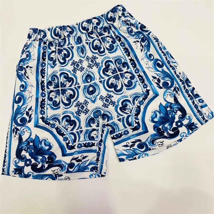 High end children\'s clothing factory wholesale 2024 summer new boy swim wear children\'s sports shirt shorts 2pcs set blue flower