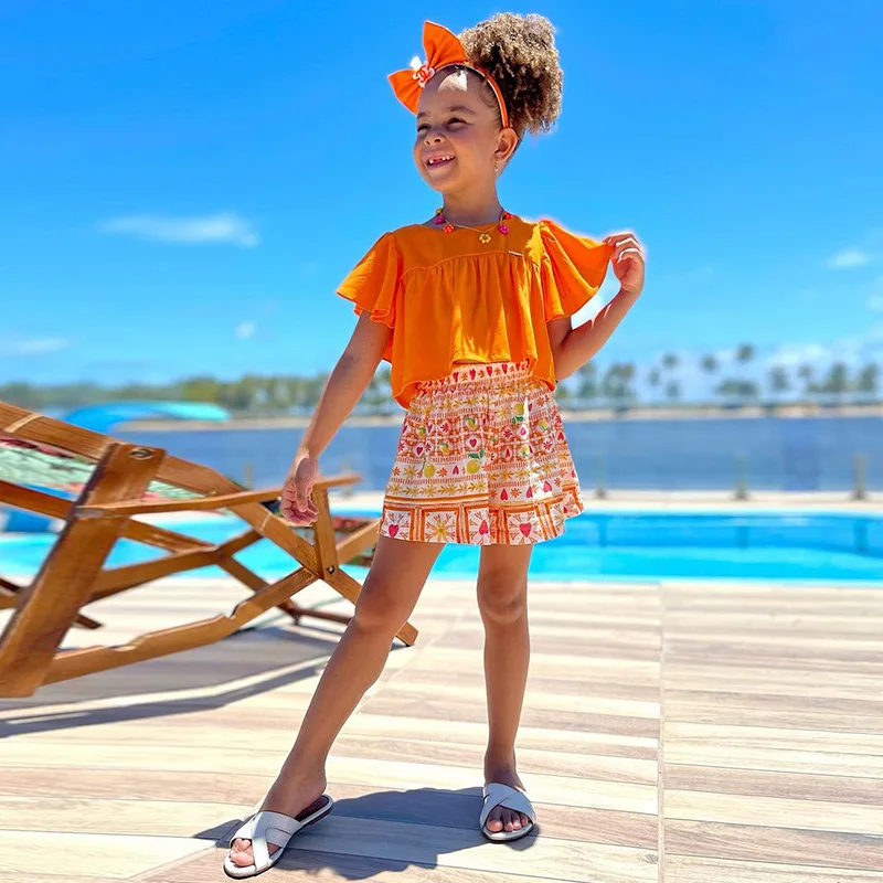 Set di vestiti estivi per neonate per bambini Casual Solid Ruffles t-shirt a maniche corte Crop Top + pantaloncini con stampa a cuore abbigliamento per bambini