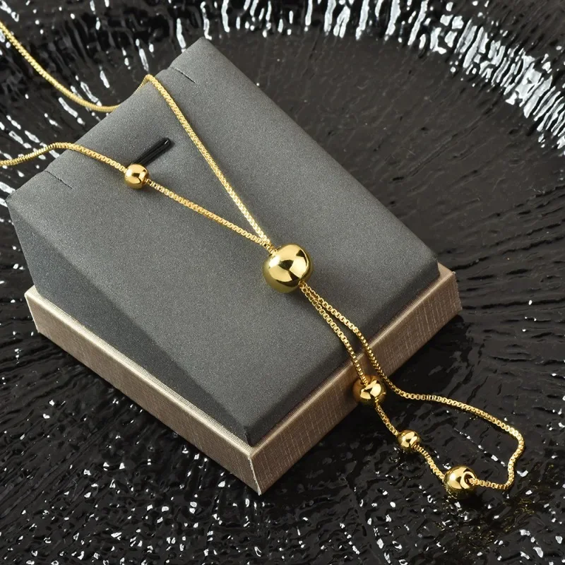 القلادة الطويلة القابلة للسحب من الفولاذ التيتانيوم هي نمط جديد للنساء في الخريف والشتاء، قلادة عصرية ومتعددة الاستخدامات