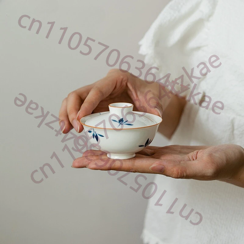 

Расписанная вручную мини-чаша для чая Гайвань из белого фарфора с узором «Орхидея-бабочка»