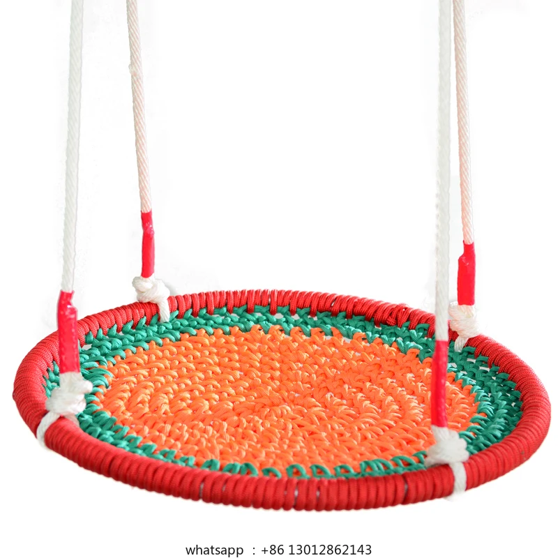 

Round bird's nest courtyard with many people swinging