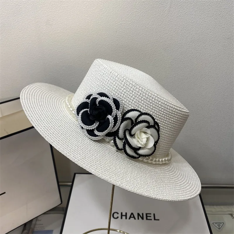 Spring and summer women\'s small fragrant wind pearl flat top hat flower fashion straw hat elegant Hepburn wind sun visor hat