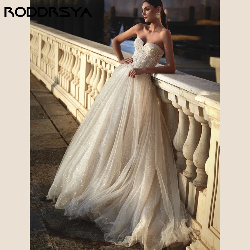 RODDRSYA Tule Cintilante Vestidos De Casamento Sem Alças Princesa Apliques Festa De Noiva Romântico Pérola Sem Encosto Zi Tule Cintilante Vestidos De Casamento Sem Alças Princesa Apliques Festa De Noivapper Custom Made