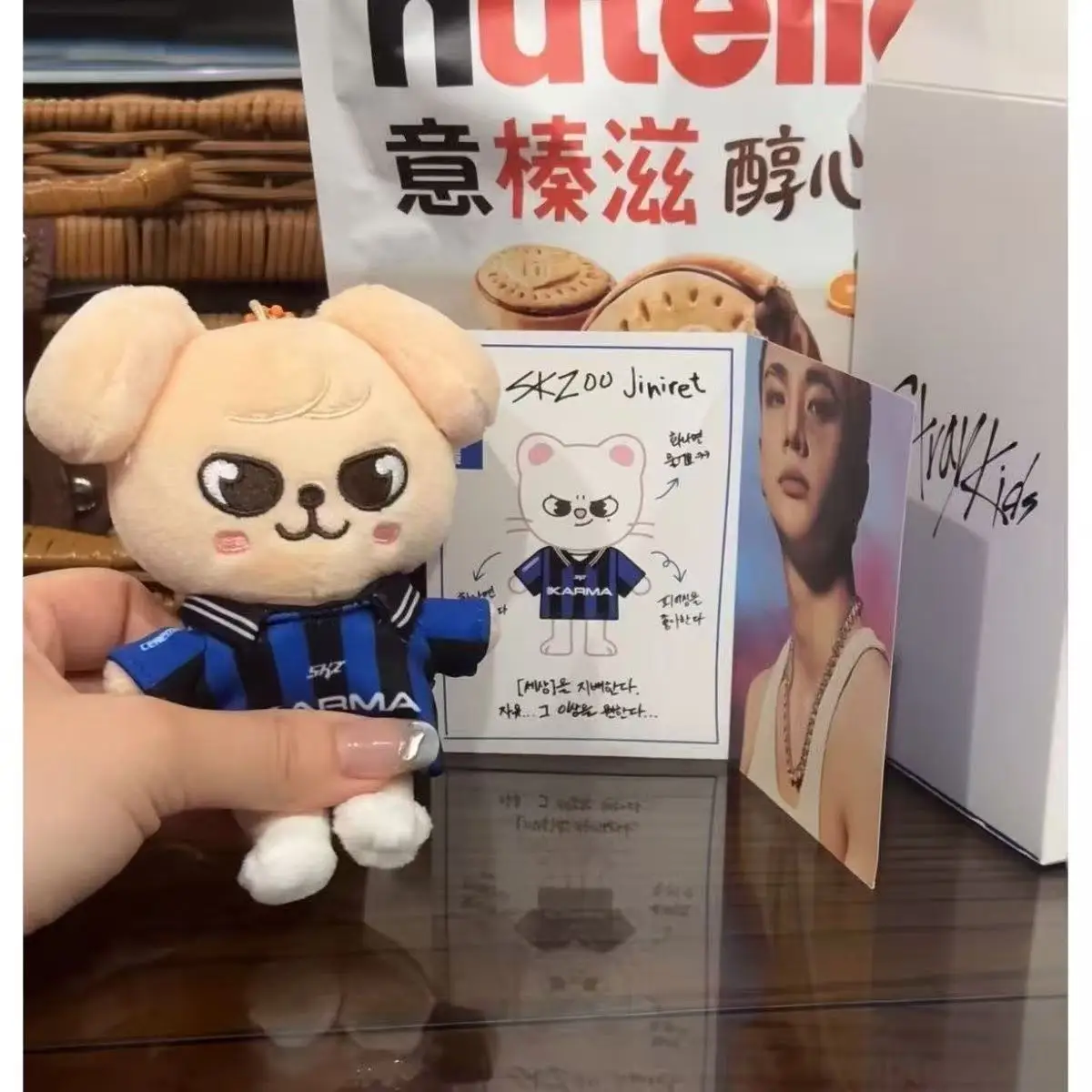 SKZOO Stray Kids keychain, featuring a blue and black jersey