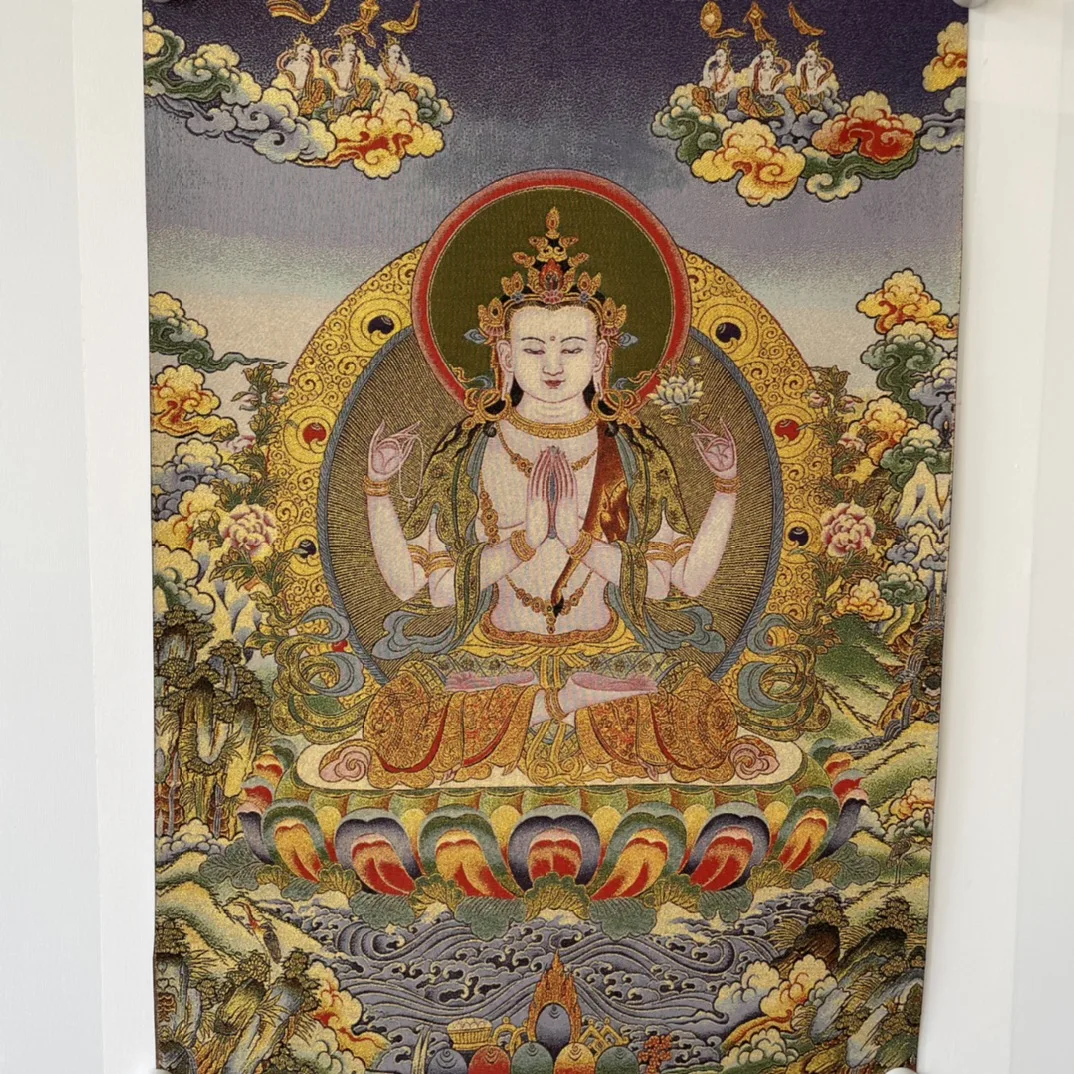 Precision embroidery of four-arm Guanyin thangka on Tibetan cloth in Tibet, China