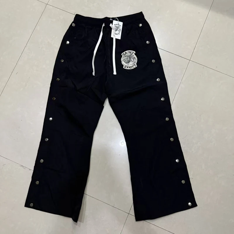 High Quality SAINT VANITY Casual Pants Streetwear Hip Hop Fashion Snap Button Track Pants
