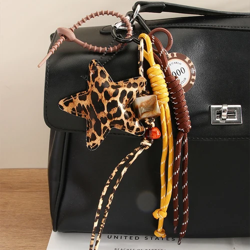 Imagen 2 del producto Colgante de bolso de estrella de mar, llavero decorativo de cuero de arcoíris, oso leopardo, bolso de cuerda trenzada de moda, regalo, accesorio multiusos