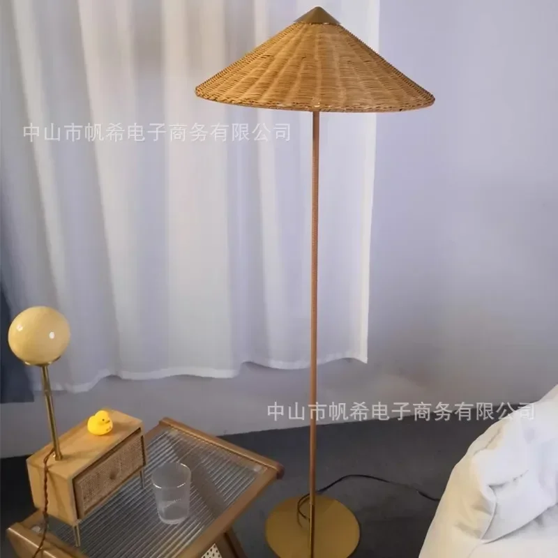 Floor lamp medieval Danish living room sofa next to designer rattan bed and breakfast hotel lamp