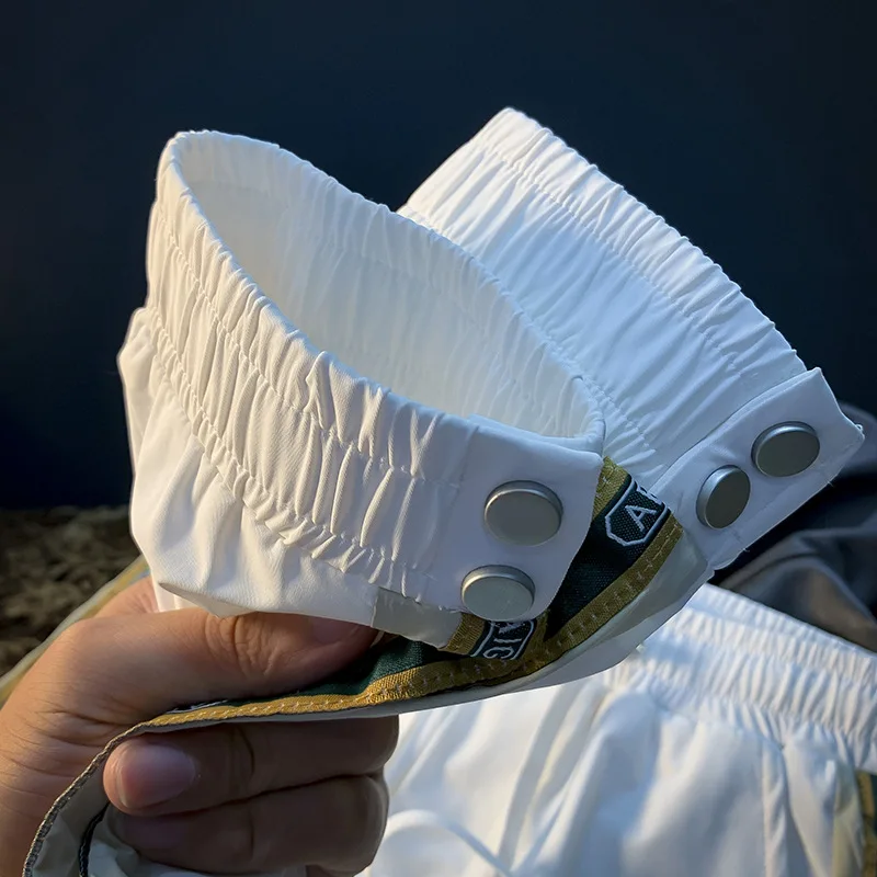 2025 ฤดูร้อนหรูหรากางเกงลําลองผู้ชายขายืดหยุ่นกระชับแบรนด์อินเทรนด์การออกแบบแถบด้านข้างกางเกงกีฬา