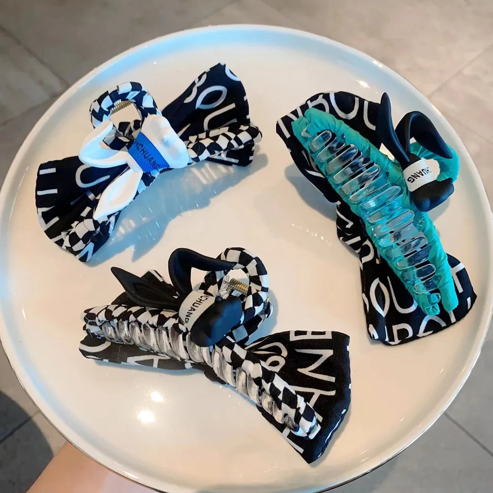 

Korean three-dimensional rabbit ear hairpin - blue, white and black three-color letter ribbon creative headdress