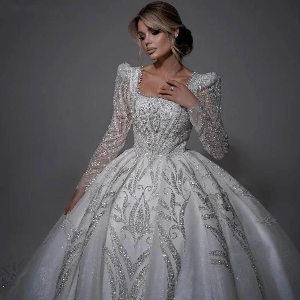 فساتين زفاف مخصصة رائعة من خرز اللؤلؤ ذيل طويل رقبة مربعة وأكمام طويلة فستان زفاف Vestidos De Novia 2025