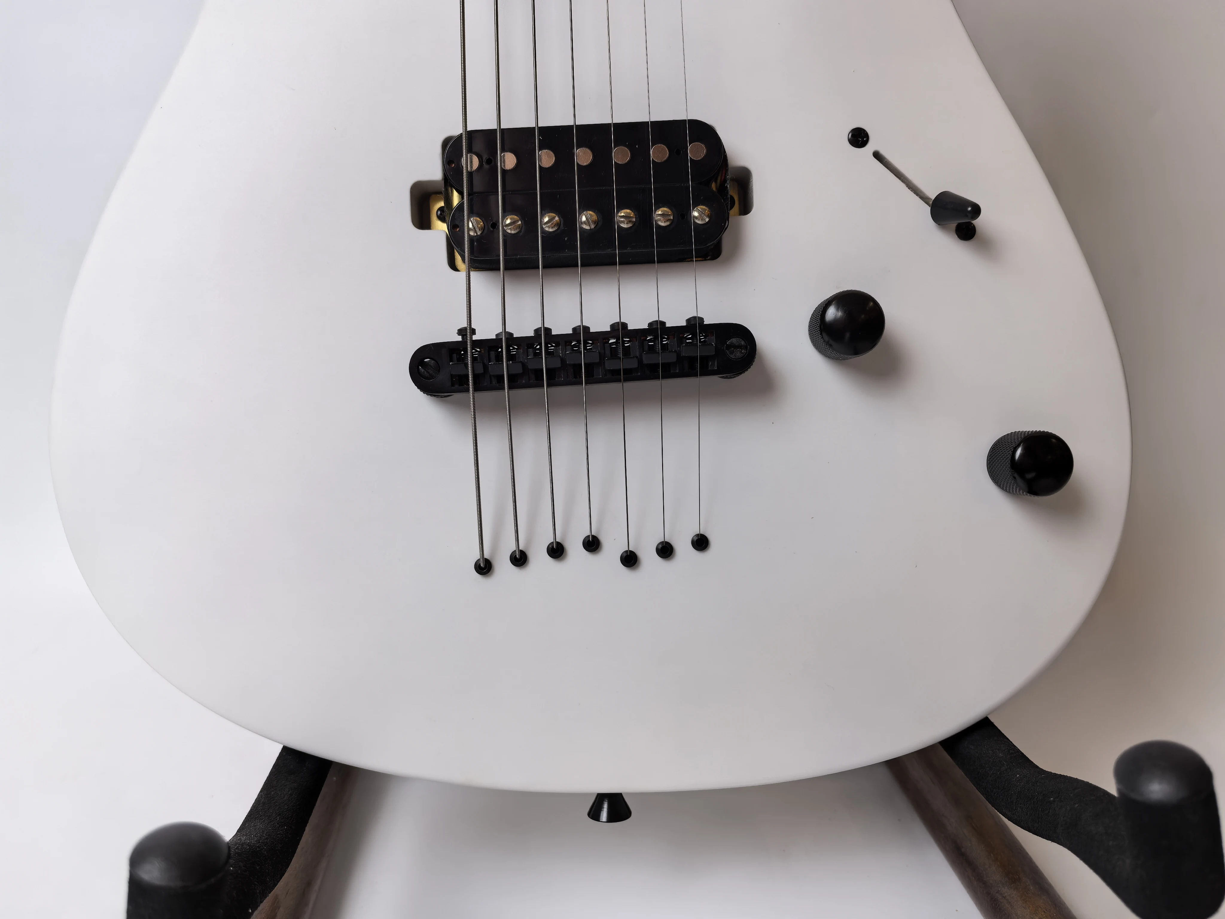 Stock, customizable, factory direct, matte white 7-string Okouman electric guitar, ready to ship when you place an order!