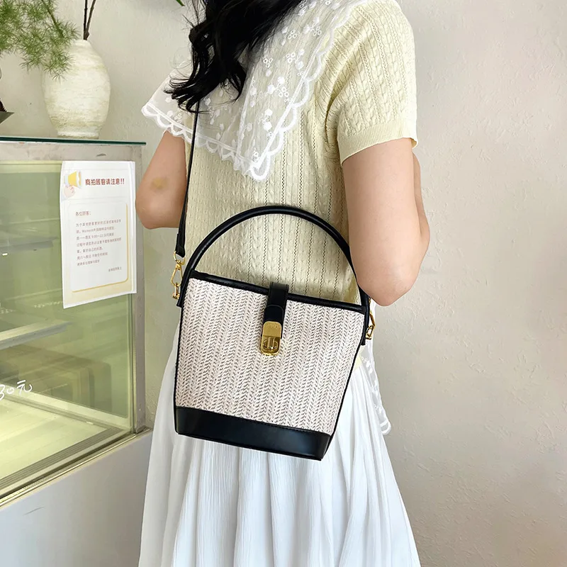 

Weaving 2025 Summer New straw weaving trend solid color Niche design cross-body versatile shoulder hand-carry bucket bag