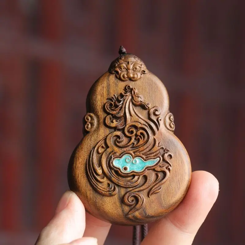Agarwood pendant with a double-sided carved design of a galloping horse and auspicious clouds, a handcrafted art piece, suitable