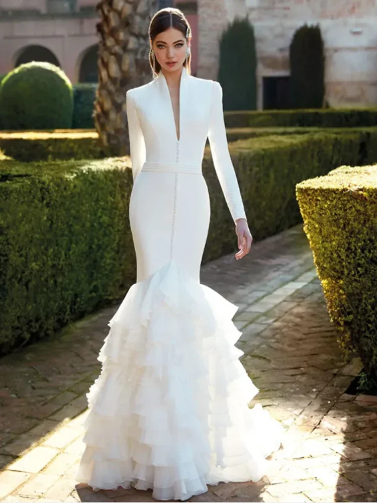 فستان زفاف أنيق بأكمام طويلة حورية البحر ورقبة على شكل V عميقة ومزين بكشكشة من الخلف لحفلات الزفاف للنساء فيستدو دي نوفيا