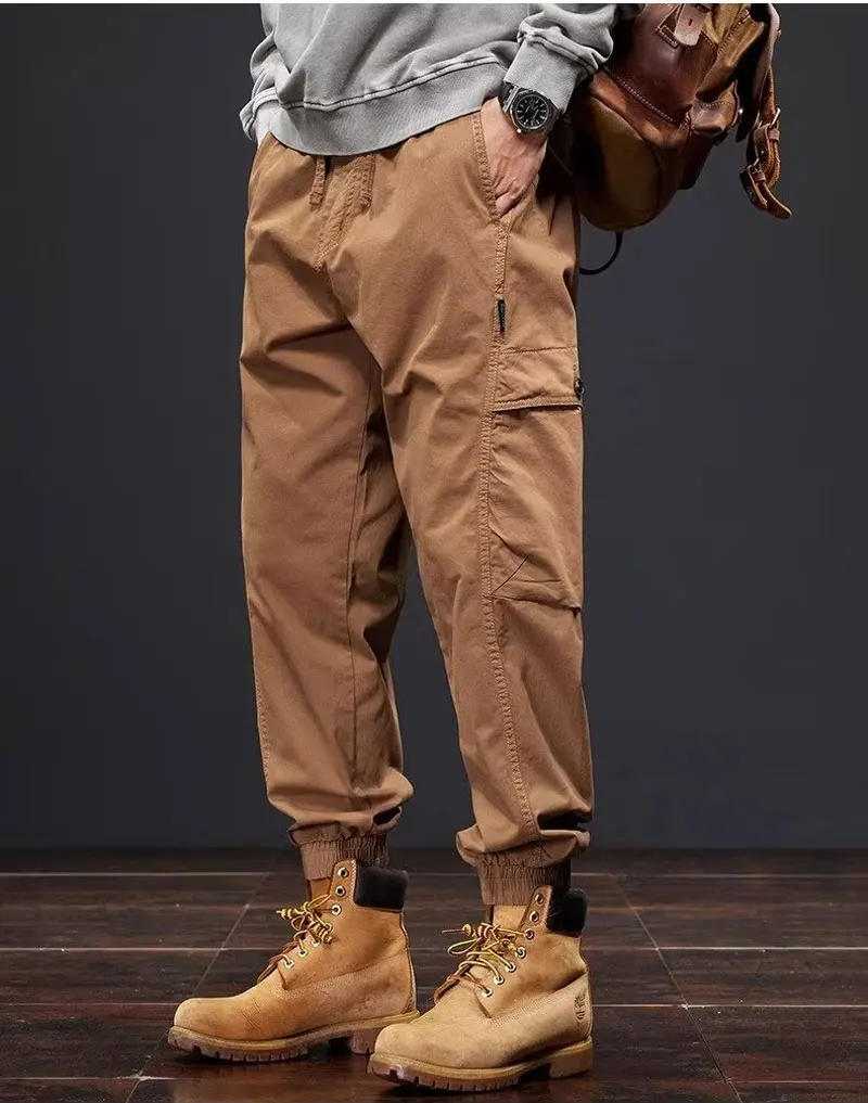 

Orange overalls men loose bunched feet outdoor mountain casual pants male designer niche pants