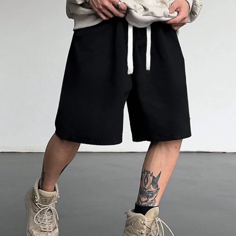 

Loose men's solid color shorts with drawstring waistband, loose gothic street style men's shorts, fashionable and casual