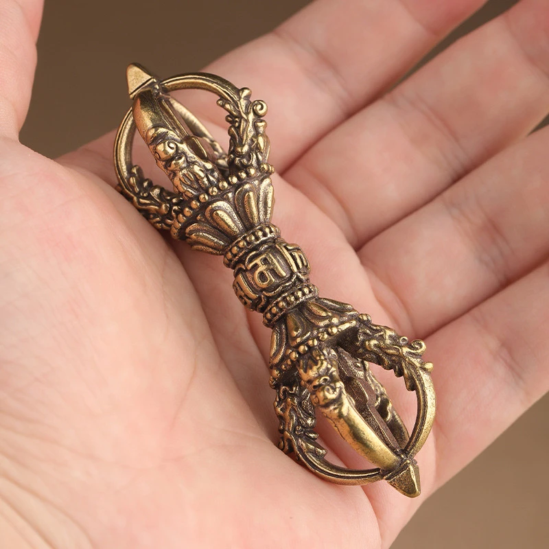 

Diamond pestle pendant with six character mantra pattern