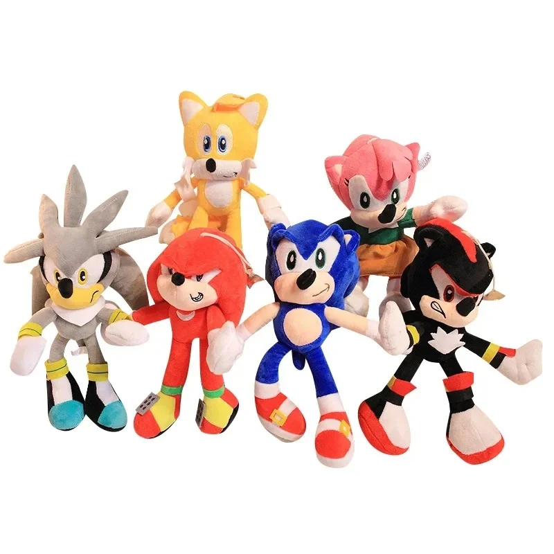 Venta al por mayor de muñecos de peluche de 28 cm, en colores negro, azul, rosa y amarillo, con diseño de Sonic, suaves y rellenos, ideales como decoración navideña y regalos para niños.