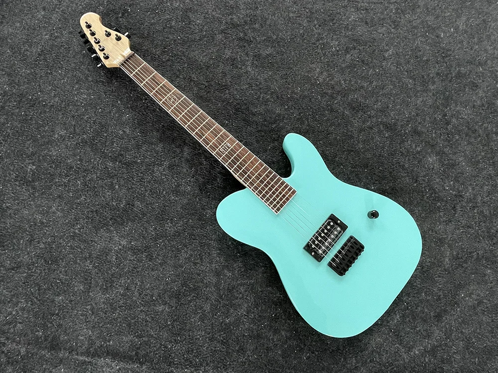 high quality classic 7 string electric guitar, seafoam green body, black accessories,  free delivery