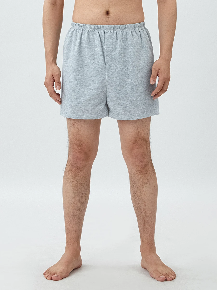 Short de salon pour femmes et hommes, couleur unie, fente latérale, confortable, taille élastique, short de sommeil, pantalon carillon