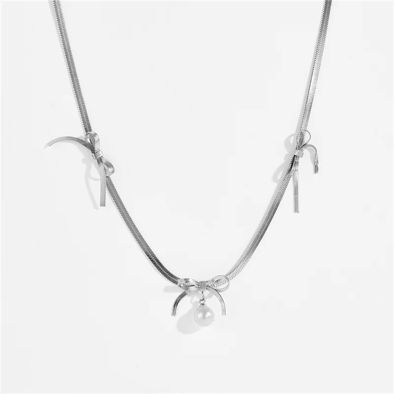 طقم مجوهرات على شكل فيونكة عتيقة من الفولاذ المقاوم للصدأ وقلادة وأقراط من اللؤلؤ، طراز أنيق متعدد الاستخدامات، عصري للنساء