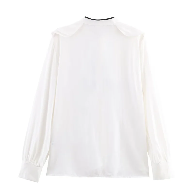 Tendência da moda feminina outono 2025: camisa decorativa em camadas com laço de bloqueio de cores