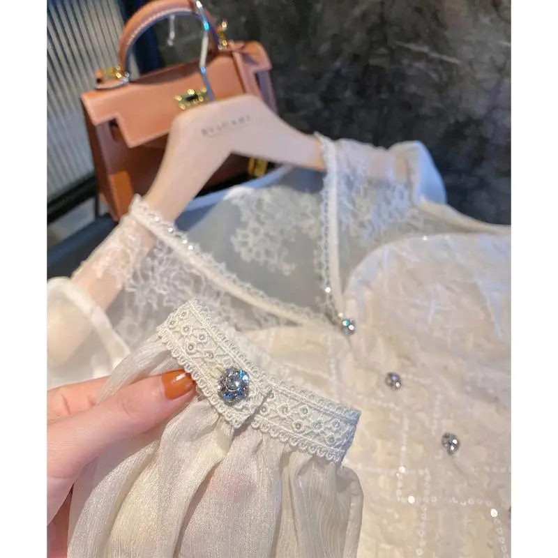 女性用ラインストーンボタン付きスパンコールブラウス、Vネックシャツ、長袖、女性用スリムトップ、スタイリッシュなレースパッチワーク、ヴィンテージでエレガント、シック