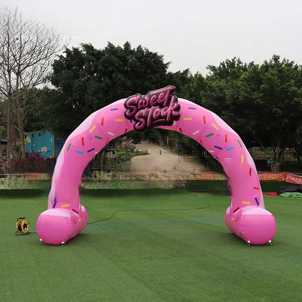 ที่กําหนดเองสีชมพู Inflatable วันเกิด Party Arch พร้อมเครื่องเป่าลม Air Blow Gate Candy Donut Inflatable Archway สําหรับกิจกรรมกลางแจ้ง