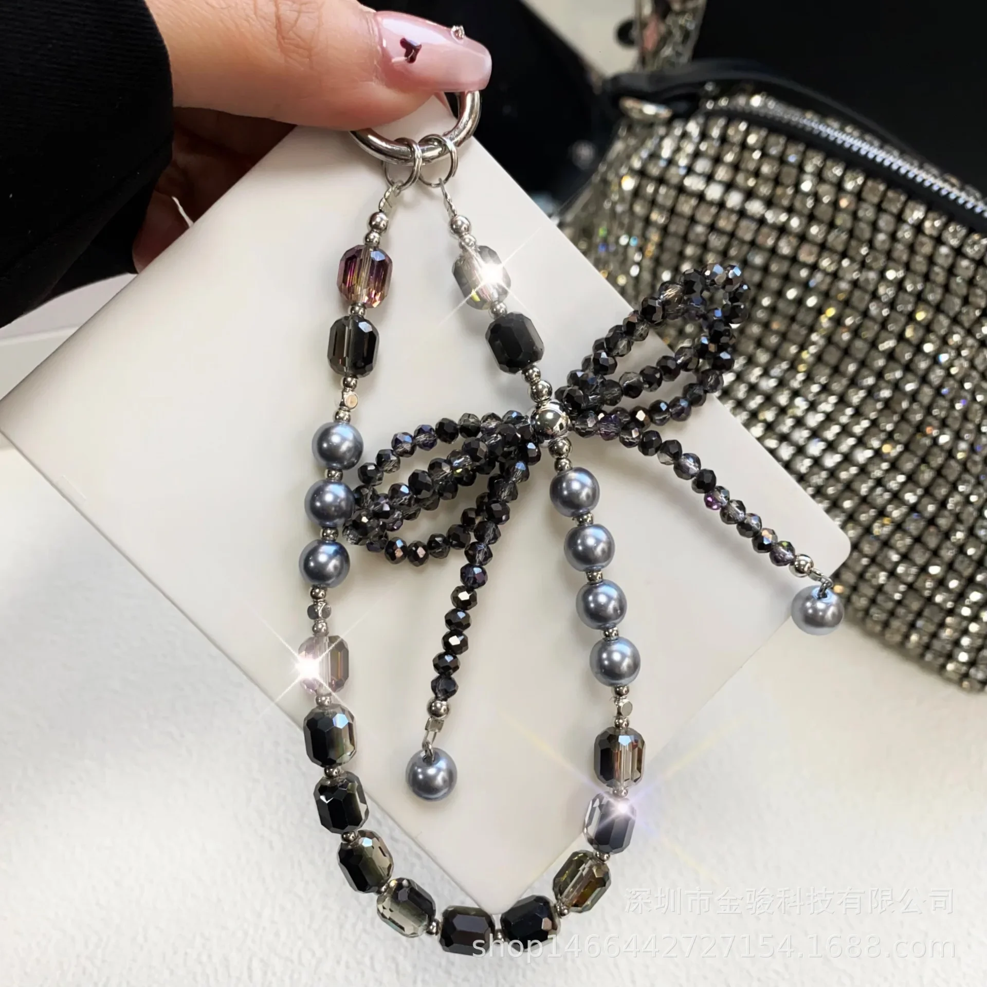 

Mobile phone chain Advanced sense three-dimensional crystal bow key chain Pearl mobile phone lanyard wrist model