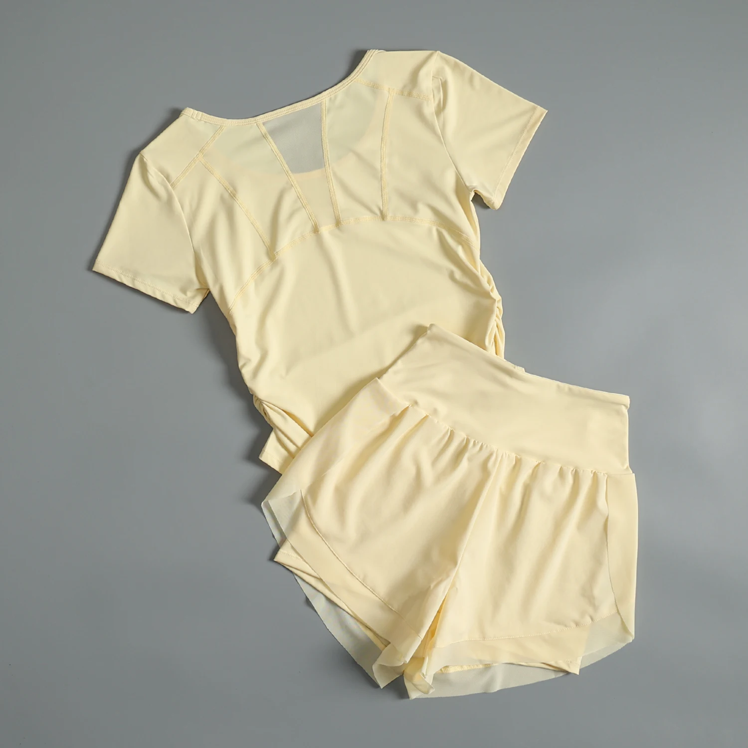 夏用女性用スポーツスーツメッシュ通気性ヨガトレーニング半袖高価値屋外ランニングスピードドライフィットネススーツ