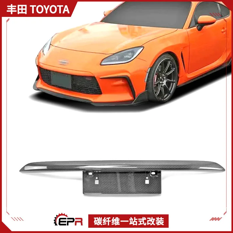 

Подходит для деталей модификации из углеродного волокна Toyota GR86 ZN8, передняя средняя сетчатая рамка номерного знака TOMS, индивидуальное обновление