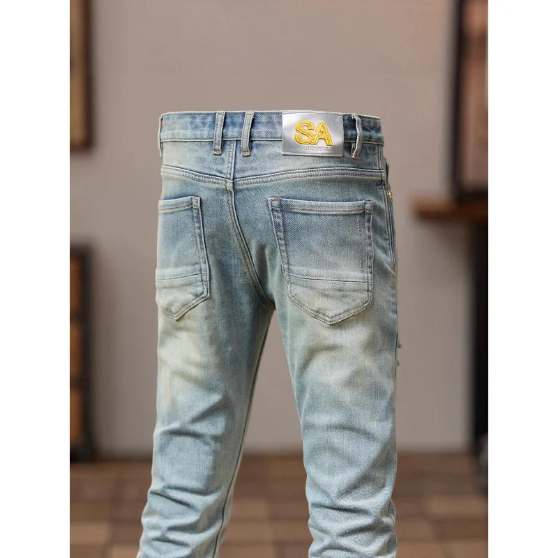 جينز ممزق وسيم للشارع روفيان لعام 2025 للرجال ذو اتجاه حنين عتيق بقصة ضيقة وأقدام صغيرة سراويل مخصصة متعثرة