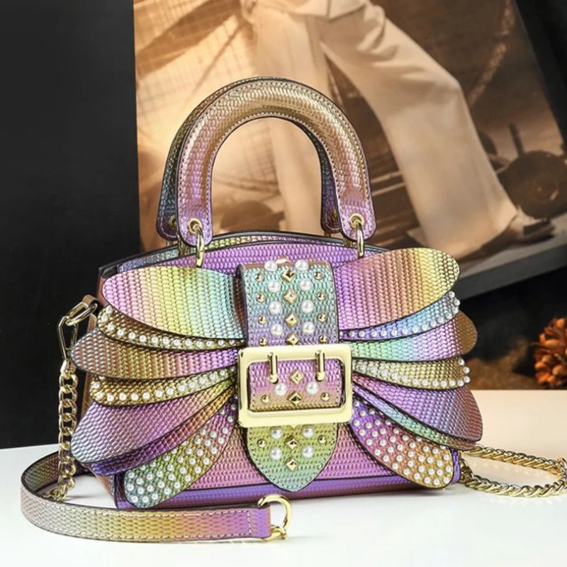 

The 2025 New Pearl Rivet Wing Women's Bag Is A Trendy And Stylish Mini Handbag That Can Be Worn On One Shoulder And Is Versatile