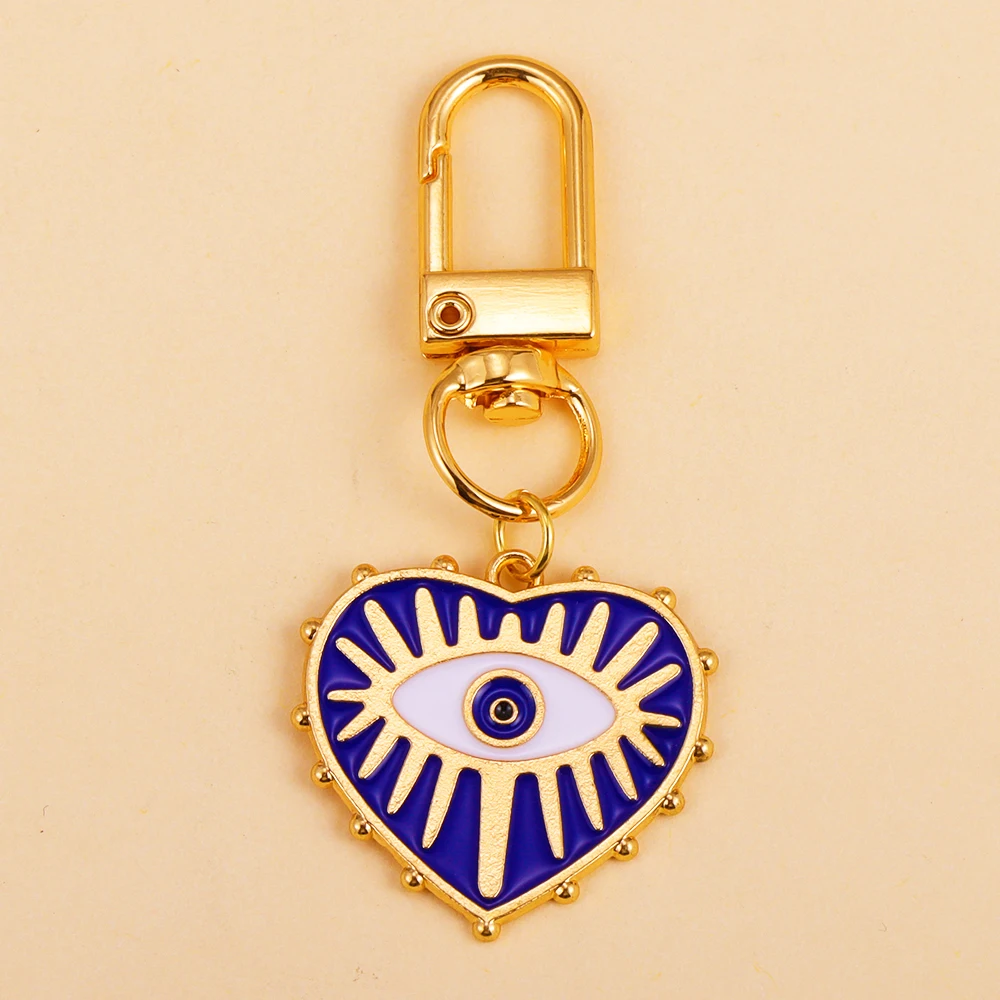 Llaveros de aleación con cierre giratorio para mujer, llavero con colgante de corazón de amor, ojo azul malvado, accesorio de decoración para bolso