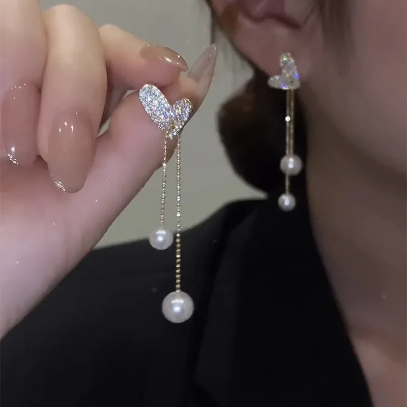 Stylish heart shaped pull out pearl tassel earrings for women popular online light luxury high end feel versatile face slimming